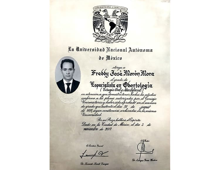 Diploma from Universidad Nacional Autónoma de México awarded to Dr. Freddy José Morón Mora, specialist in Oral and Maxillofacial Surgery, featuring his photo and university emblem.